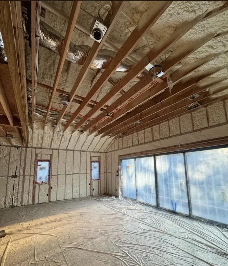 Interior walls and ceiling insulated with spray foam during new construction in Englewood